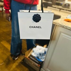 CHANEL White Bag with Black Flower Accent
